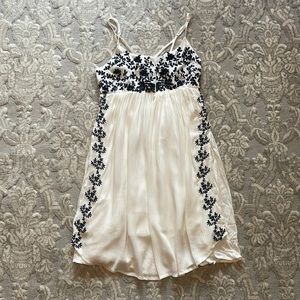 White mini dress with floral embroidery